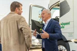 Peter Van den Eynde in front of electric truck